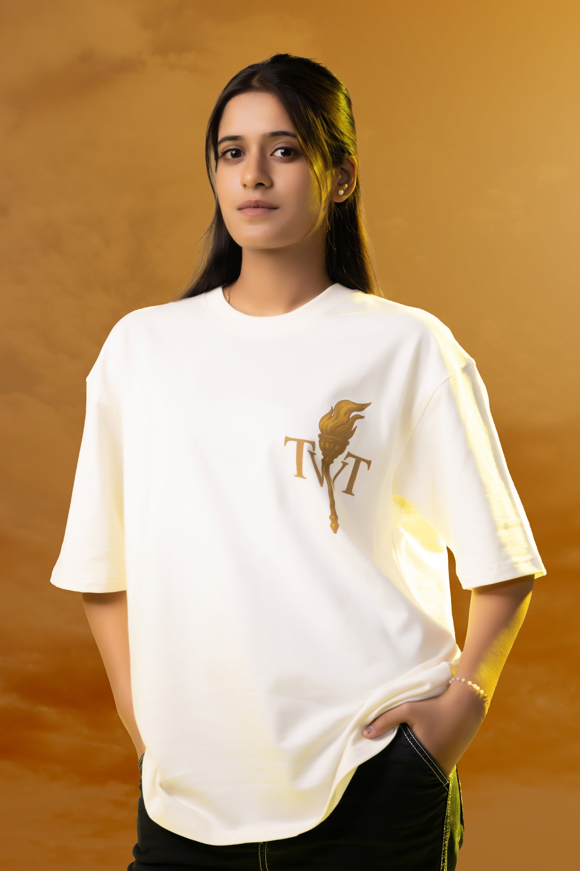 Woman wearing a white t-shirt with a logo on an orange background
